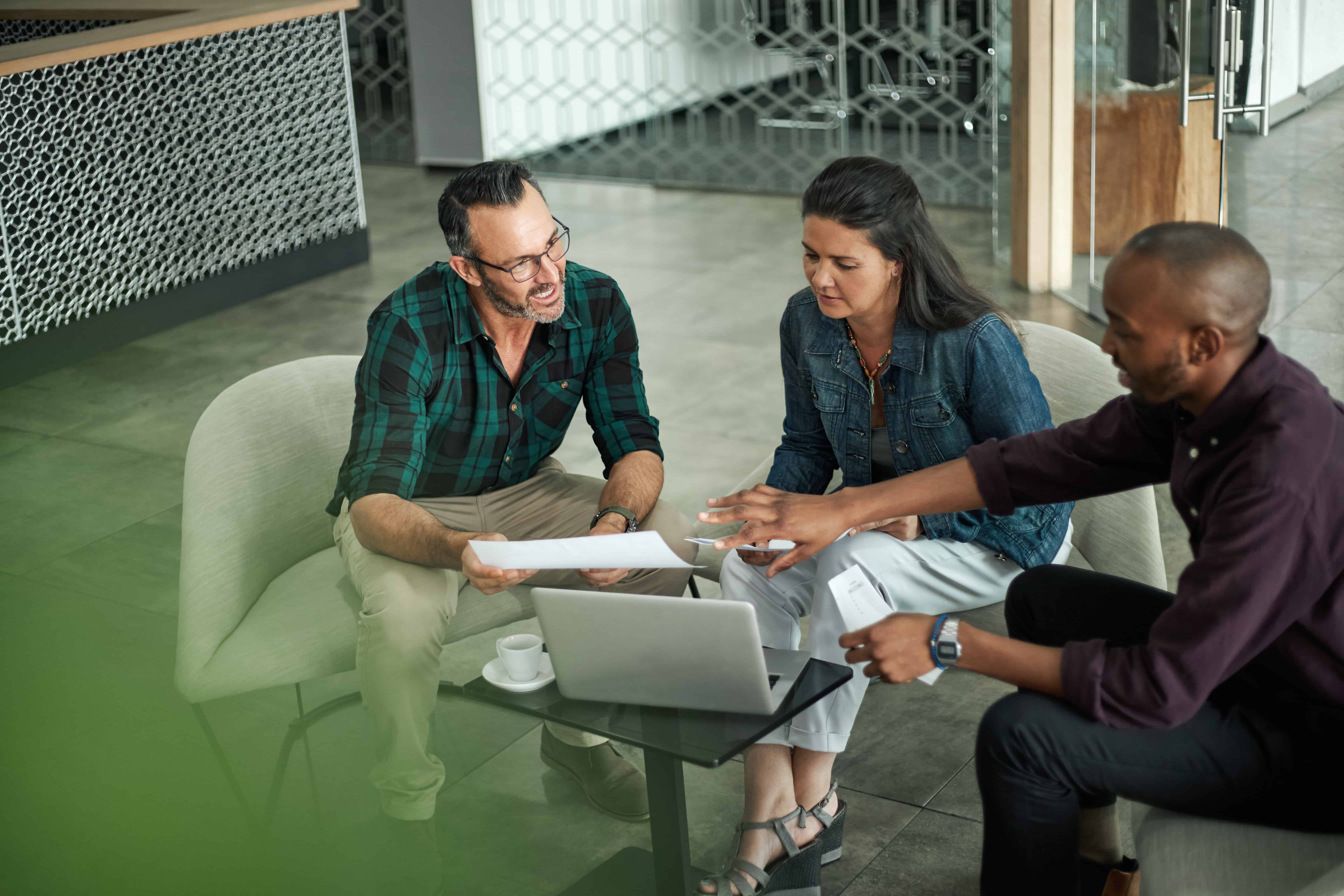 Three people having a meeting